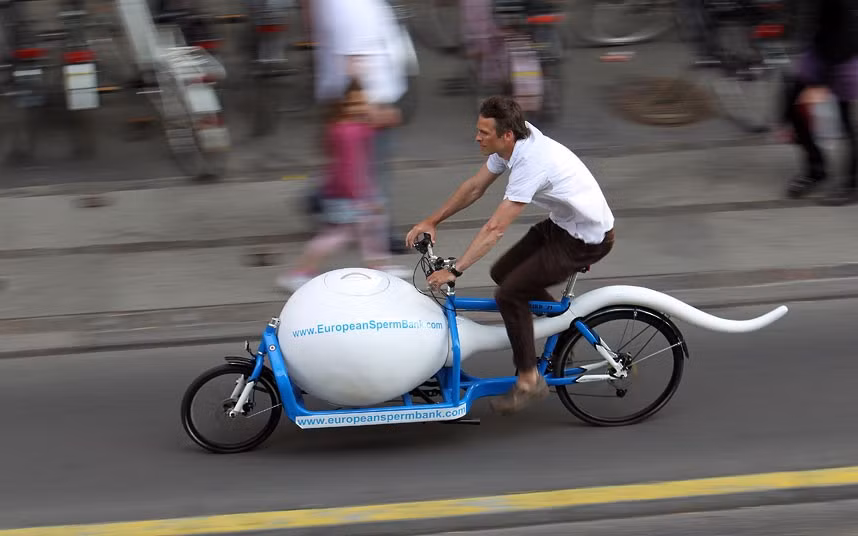 A man rides the European Sperm Bank’s ’Spermbullit’ on the streets of Copenhagen, Denmark, to transport sperm to fertility clinics