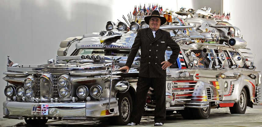 Finne Antti Rahko stands next to his self-made Finnjet during preparations for the Essen Motor Show in Essen, western Germany. The vehicle, with eight wheels and ten seats, weighs 3.4 tons. 