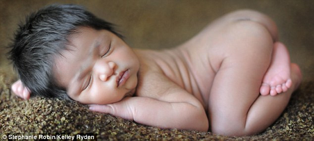 Out on the floor: It’s no struggle to snuggle up to a warm rug Read more: http://www.dailymail.co.uk/news/article-1251841/The-incredible-pictures-snoozing-newborns-taken-babies-10-days-old.html#ixzz0frKtIlnJ