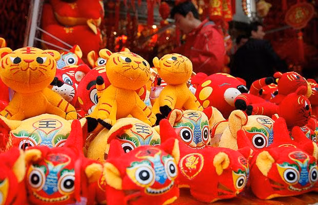 Stuffed tiger dolls are sold at a street stall in Shanghai