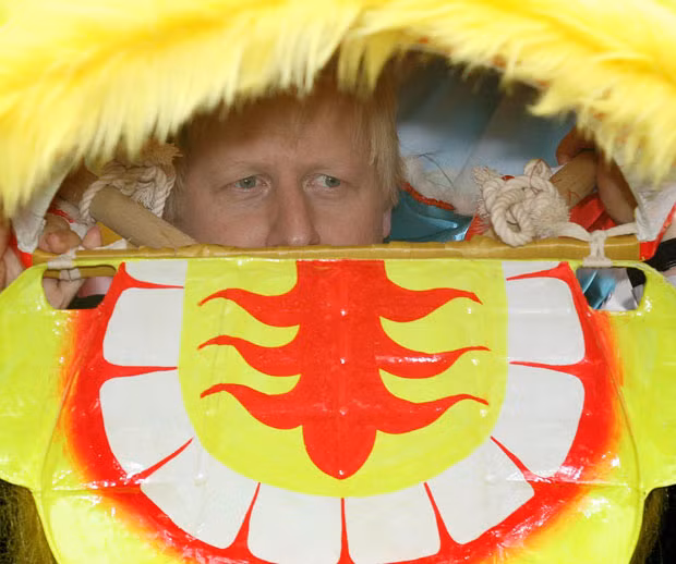 Mayor of London Boris Johnson wears a Chinese dragon costume at a photocall in Chinatown to promote the capital’s Chinese New Year celebrations