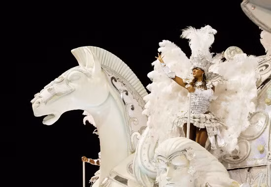 A reveller of the Imperatriz Leopoldinense samba school rides on a float in Rio de Janeiro’s Sambadrome