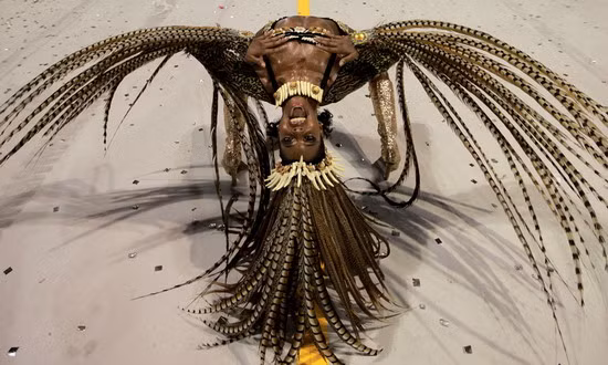 A dancer performs during the parade of Leandro de Itaquera samba school at the Sambadrome in Sao Paulo, Brazil 