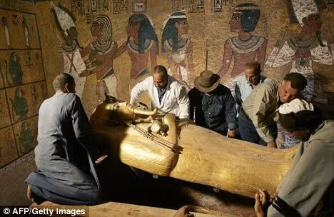 Egypt’s antiquities chief Zahi Hawass (third left) headed the latest study of King Tut. He is seen here with the sarcophagus of the pharaoh in in 2007 Read more: http://www.dailymail.co.uk/sciencetech/article-1251476/King-Tutankhamun-died-broken-leg-worse-malaria.html#ixzz0fn5xXZyR