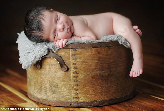 Crib sheet - and this hatbox beats my cradle any day Read more: http://www.dailymail.co.uk/news/article-1251841/The-incredible-pictures-snoozing-newborns-taken-babies-10-days-old.html#ixzz0frKbiiuz