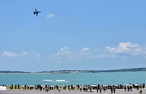 A Royal Australian Air Force F-111 flies over the sea