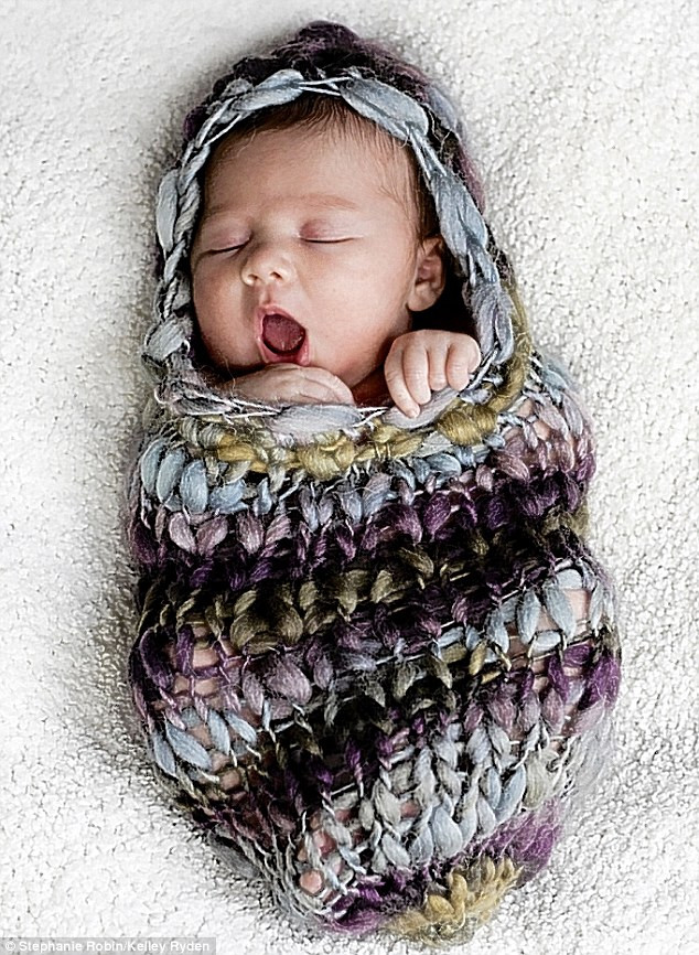 Yawn free: I love crashing out in my mum’s knitting! Read more: http://www.dailymail.co.uk/news/article-1251841/The-incredible-pictures-snoozing-newborns-taken-babies-10-days-old.html#ixzz0frLbkVm6