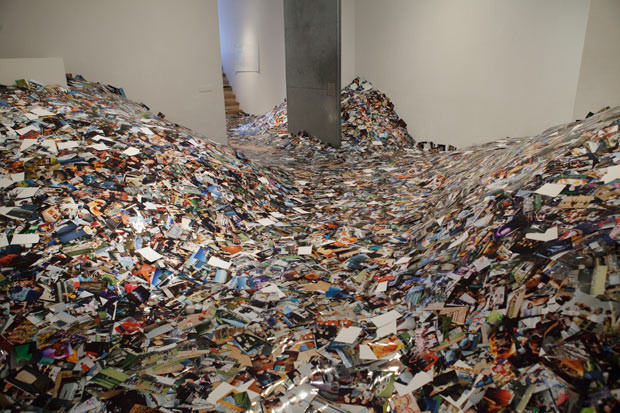 An artist has filled a room with pictures after downloading and printing out every picture uploaded to Flickr in 24 hours. Dutch artist Erik Kessels is displaying the collection of more than one million images at Foam in Amsterdam. The mountain of photos is a reminder of the volume of information and data that is being shared on the Internet every day. Six billion photos are on Flickr at the moment, and the same number of photos are uploaded to Facebook every two months. 