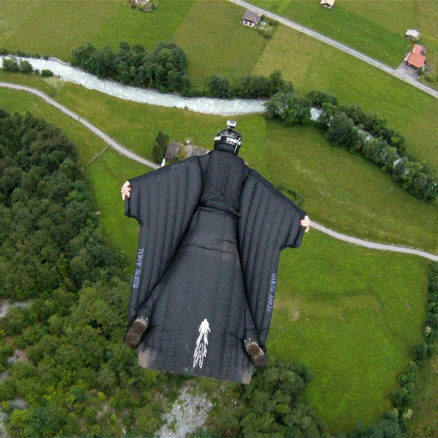 Jeb Corliss flies over Lauterbrunnen, Switzerland, wearing a wingsuit. Hurtling through the air at 85 miles an hour, daredevil adventurer Jeb Corliss becomes the first man to fly through a waterfall wearing a wingsuit.