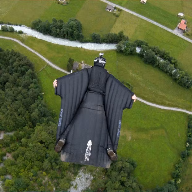 Jeb Corliss flies over Lauterbrunnen, Switzerland, wearing a wingsuit. Hurtling through the air at 85 miles an hour, daredevil adventurer Jeb Corliss becomes the first man to fly through a waterfall wearing a wingsuit.
