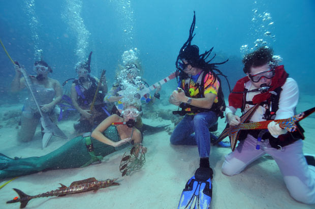 Musicians take part in the 27th Underwater Music Festival in Big Pine Key, Florida. More than 500 divers and snorkellers descended on the Florida Keys National Marine Sanctuary for an underwater concert.