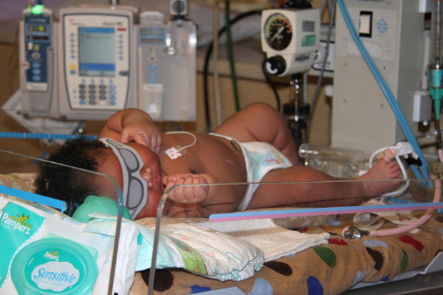 Newborn baby JaMichael Brown lays in Good Shepherd Medical Centre in Longview, Texas. When born on July 8, he weighed 16 pounds and one ounce, more than double the national average for a newborn, and measured 24 inches long, just a few inches shy of an average one-year-old.