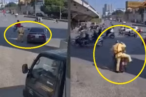 Video: Chiến sĩ CSGT nhảy lên xe ôm nhờ đuổi theo ô tô vi phạm bỏ chạy