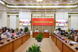 Quang cảnh buổi họp trực tuyến tại đầu cầu TP.HCM. Ảnh Trung tâm BC TP.HCM.