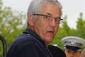 John Cooper khi bị bắt.