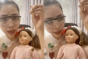 Video Thơ Nguyễn ôm trong tay một búp bê (Ảnh: cắt từ clip).