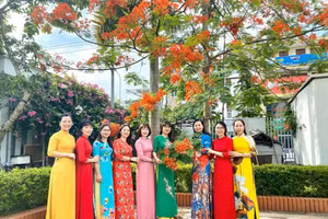 Cán bộ lãnh đạo, quản lý, nhân viên Sở GD&ĐT Bắc Giang hưởng ứng tuần lễ áo dài (Ảnh TL).