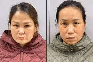 Trần Thanh Hiếu (trái) và Lương Ngọc Loan tại cơ quan công an.