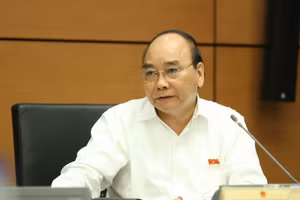 Chủ tịch nước Nguyễn Xuân Phúc thảo luận tại Quốc hội. Ảnh: VGP