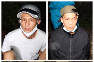 Đối tượng Trần Trung Hải (trái) và Trịnh Hoàng Sơn cùng tang vật của vụ án bị lực lượng công an bắt quả tang.