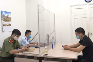 Anh T.V.D. làm việc với cơ quan chức năng.