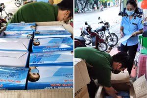 Đoàn kiểm tra liên ngành kiểm tra số khẩu trang y tế có dấu hiệu vi phạm. Ảnh: Cục QLTT tỉnh Tuyên Quang