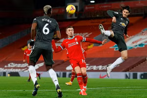 Liverpool và MU bất phân thắng bại trong trận "derby nước Anh". Ảnh: DM