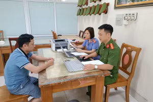 Đào Quang Hiệp tại cơ quan công an.