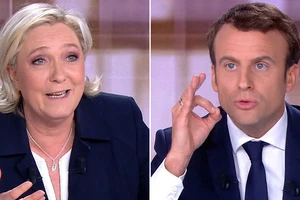 Tổng thống Pháp Emmanuel Macron và đối thủ Marine Le Pen (trái).