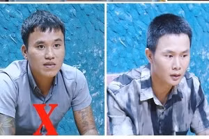 Trần Văn Ngọc (bìa trái) và Nguyễn Văn Hoan bị bắt giữ.