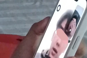 Ảnh cắt từ clip em H. gọi về cho gia đình. Ảnh: CACC.