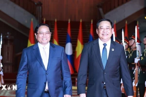 Thủ tướng Phạm Minh Chính hội kiến Thủ tướng Lào Sonexay Siphandone, Chủ tịch ASEAN 2024. (Ảnh: Dương Giang/TTXVN)