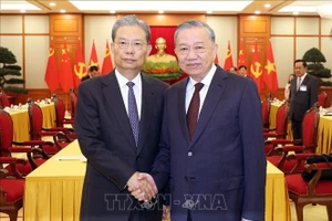 Tổng Bí thư Tô Lâm và Ủy viên trưởng Nhân đại toàn quốc Trung Quốc Triệu Lạc Tế. Ảnh: Thống Nhất/TTXVN.