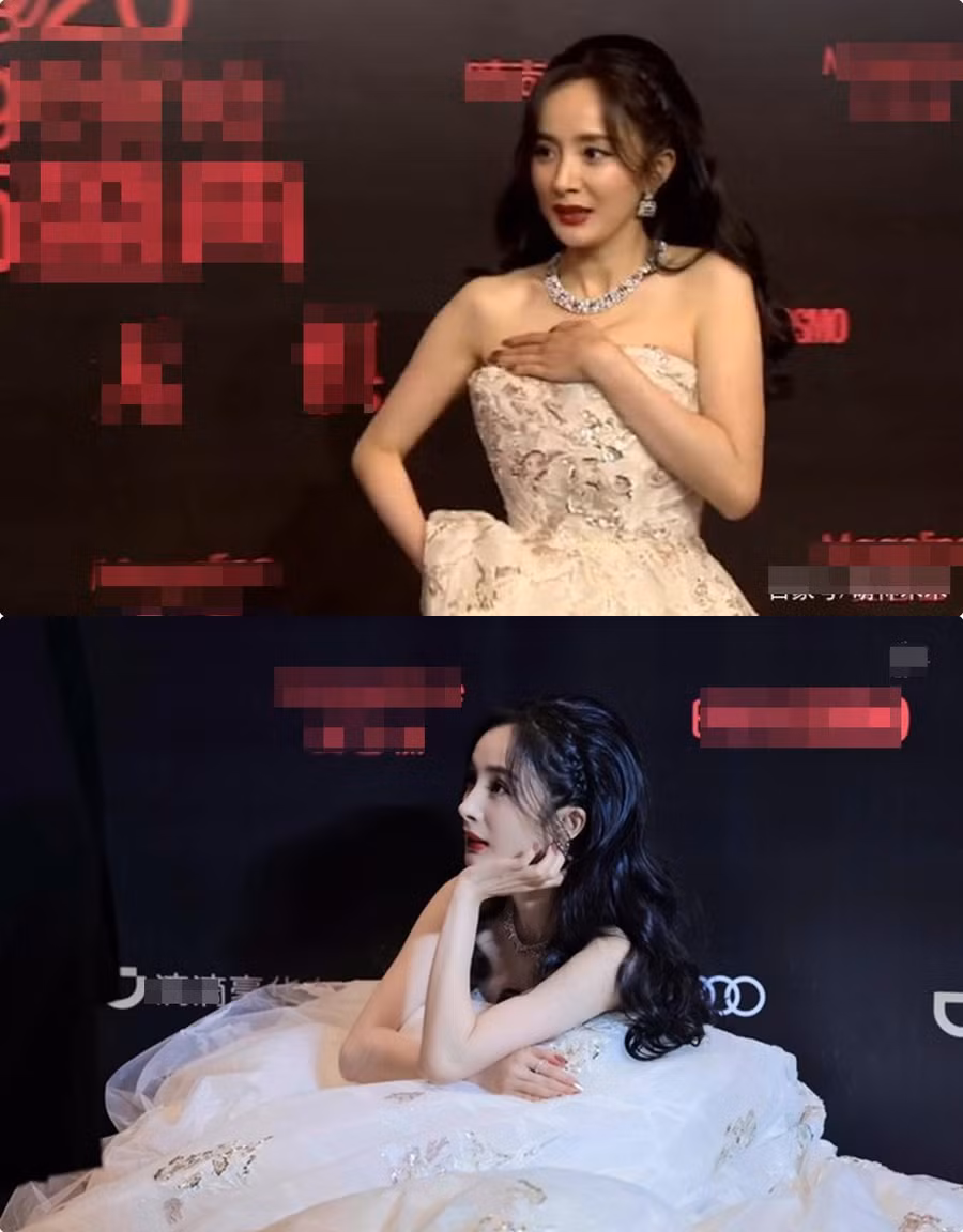 Vừa mệt mỏi để giữ ngực vì đuôi váy dài có thể khiến phần cúp ngực bị tuột như chơi. Sau rồi cô nàng có vẻ mệt vì váy quá nặng nên đã ngồi sụp xuống luôn như thế này.