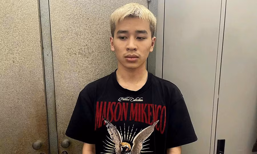 Thân Văn Nam tại cơ quan công an.