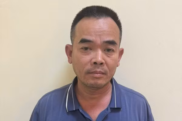 Đinh Văn Long tại cơ quan công an. Ảnh: TG